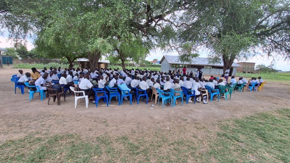 Students gathered for a community learning activity in South Sudan